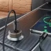 Front view of XO CC70 USB-C car charger plugged into car socket with charging cables connected on console surface
