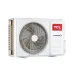 Outdoor view of TCL 1 Ton Inverter AC compressor unit with large fan grille, side vents, and red TCL inverter branding.