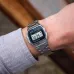 Wrist view of Casio Vintage Watch with stainless steel band showing time, date, and alarm chrono display.