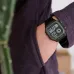 Close-up wrist view of Casio AE-1200WHB-1BVDF Digital Watch with rectangular face and black strap beside cactus.