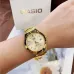 Wrist view of Casio LTP-1170N-9ARDF Watch with round gold dial, date window, and metallic gold band beside Casio box.
