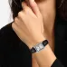 Close-up wrist view of Casio LTP-1234LL-7ADF Watch with light dial, silver markers, and black strap near face.