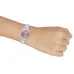 The Casio LTP-1302DD-4A1VDF Watch worn on the wrist, showcasing its pink dial and stainless steel bracelet.
