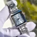 Close-up of Casio LTP-V007D-2EUDF Ladies Chain Watch held by gloved hand showing silver dial and markers.