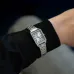 Close-up wrist view of the Casio LTP-V007D-7BUDF Ladies Chain Watch paired with a sleek black sleeve.