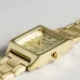 Casio LTP-V007G-9EUDF Ladies Chain Watch front view rectangular gold dial gold markers and hands on gray surface