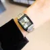Display view of Casio LTP-V007L-9EUDF Ladies Chain Watch with silver dial, gold hands, and brown strap on cushion.