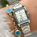 Close-up wrist view of Casio LTP-V007L-9EUDF Ladies Chain Watch with brown strap and silver case on green fabric.