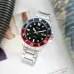 Front view of Casio MDV-107D-1A3VDF Chain Watch with black dial, red-blue bezel, and stainless steel bracelet.