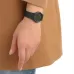 Wrist view of Casio MQ-24-1B2LDF Unisex Watch with black dial, gold numerals, and hands against tan sleeve.