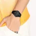 Wrist view of Casio MRW-200H-1B2VDF Analog Watch with black dial and bezel worn with yellow shirt.