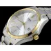 Front view of Casio MTP-1183G-7ADF Analog Watch with silver dial, gold bezel, and two-tone stainless steel band.