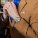 Lifestyle view of Casio MTP-1183G-7ADF Analog Watch with silver-gold band styled with blazer and dress shirt.