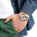 Wrist view of Casio MTP-1183G-7ADF Analog Watch with Roman numeral dial worn casually with denim jacket.