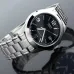 Close-up of Casio MTP-1215A-1ADF Analog Watch with silver band and mirrored black dial showing date window.