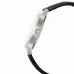 Side view of Casio MTP-1303L-7BVDF Watch with silver case, crown, and black leather strap with white stitching.