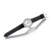 Reflective surface view of Casio MTP-1303L-7BVDF Watch showing white dial and stitched black leather strap.