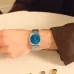 Wrist view of Casio MTP-B145D-2A2VDF Watch with stainless steel bracelet and blue dial resting on light surface.