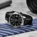 Casio MTP-V004L-1CUDF Watch displayed on a tabletop in an angled lifestyle view with its black leather strap.