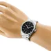 Mannequin wrist view of Casio MTP-V005D-1BUDF Analog Watch with silver band and black dial displaying bold numerals.