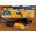 Front view of Tolsen 79542 Angle Grinder on wooden surface with packaging box highlighting specs and design.