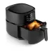 Drawer-open view of Philips 5000 Series XXL Connected Air Fryer showing cooked whole chicken and touch controls.