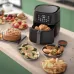 Top-down food spread view of Philips 5000 Series XXL Connected Air Fryer showing cooked potatoes and assorted dishes.