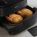 Philips NA150-09 air fryer cooking whole roasted chicken in basket using RapidAir technology with sleek black design