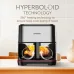 Kitchen counter view of Sharp KF-AF70M-BK 7L Air Fryer cooking chicken with 360° hyperboloid heating airflow arrows.