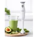 Lifestyle view of the Philips HL1680/00 300W Hand Blender standing upright beside a glass of green smoothie on a kitchen counter.