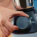 Close‑up view of the Philips HL7773/01 800W Mixer Grinder showing a hand adjusting the front control knob on the base unit.