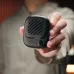 Close-up view of Aecooly NK01 Click 01 Mini Portable Neck Fan held in hand showing compact square design and front vent grille
