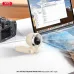 XO MF102 Handheld Fan, tabletop view in use beside a laptop with airflow directed across the workspace