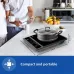 Top-down view of PHILIPS HD4944/00 Induction Cooker in a compact kitchen, showing dimensions and portability for small spaces.