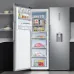 Kitchen placement view of the Samsung RZ32M71157F 315L Upright Refrigerator with the door open beside cabinetry.