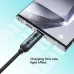 Close-up of a phone charging with the BWOO BO-X304C-C cable's flow rate light effect.