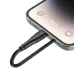 Close-up of a phone being charged by the black, braided BWOO BO-X318CL Lightning to USB-C cable.