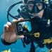 Underwater view of ACEFAST X1 Action Camera held by scuba diver showing mirrored screen effect.