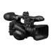 Front angled view of Canon XF605 Professional Camcorder with large lens, microphone, and broadcast-style design.