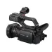 Angled rear view of the black Panasonic AG-CX10 professional camcorder.