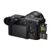 Rear-side view of the Sony FX2 camera showing the flip-out screen and open dual card slots.