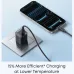 Black Anker Nano 45W charger plugged into a wall outlet, charging a smartphone via a black cable.