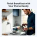 A man pours coffee in a kitchen, as a smartphone charges quickly with the Anker Nano 45W charger in the background.
