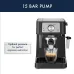 Close-up of DeLonghi EC230 Stilosa Coffee Machine showing 15-bar pump brewing espresso with crema in glass cup.