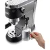 Side view of DeLonghi EC685 Dedica Style Coffee Maker frothing milk in pitcher using steam wand labeled cappuccino.