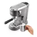 Side view of DeLonghi EC785 Dedica Metallics Coffee Maker frothing milk in pitcher with steam wand labeled cappuccino.
