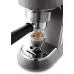 Close-up of DeLonghi EC785 Dedica Metallics Coffee Maker brewing espresso with rich crema from portafilter spout.
