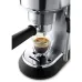 Close-up of DeLonghi EC885.M Dedica Arte Coffee Machine brewing espresso with crema from dual spout portafilter.