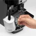 Side view of DeLonghi ECAM22-110 Magnifica S Coffee Machine frothing milk in pitcher using steam wand for cappuccino.