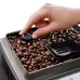 Close-up of DeLonghi ECAM250 Magnifica S Smart Coffee Machine grind size dial on bean hopper filled with roasted beans.